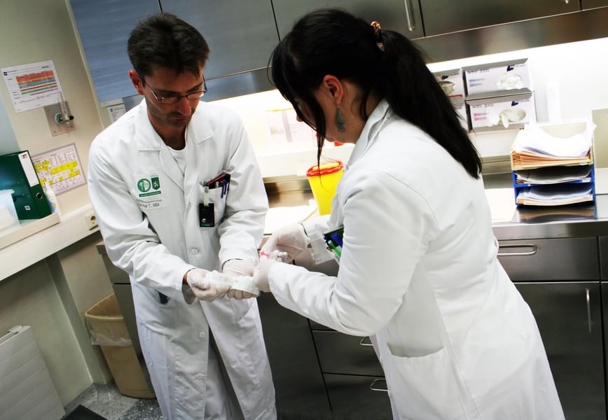IAEA personnel preparing nuclear medicine and monitoring equipment