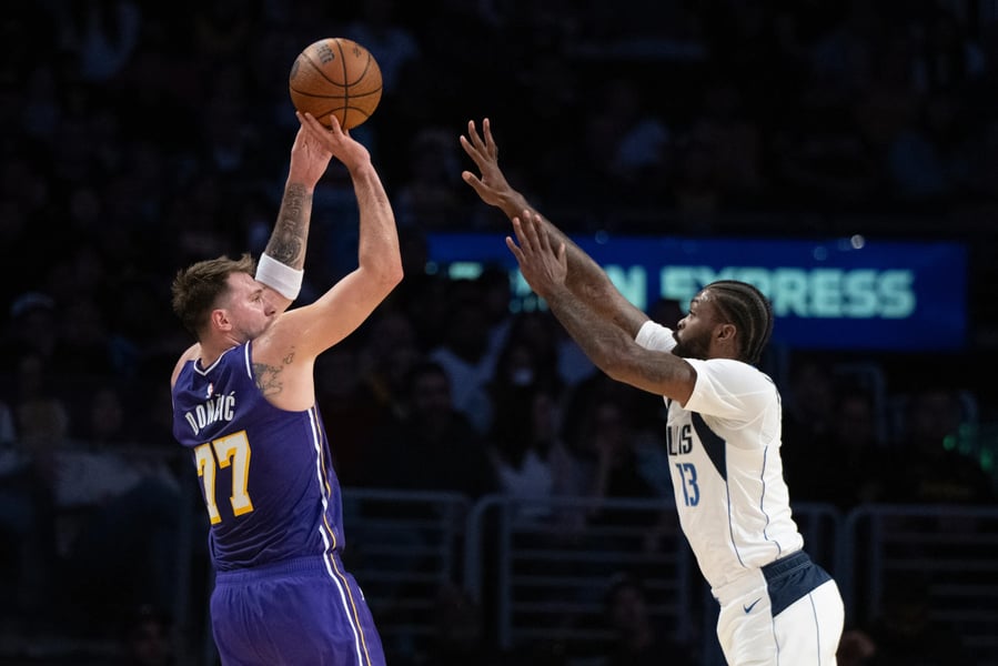 Austin Reaves Luka Doncic celebrate Lakers 129-119 win over Anthony Davis Mavericks Crypto.com Arena