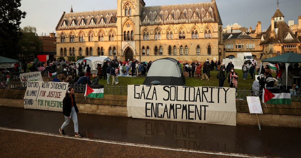 Palestinian university students protesting for family visa rights outside UK parliament in 2025