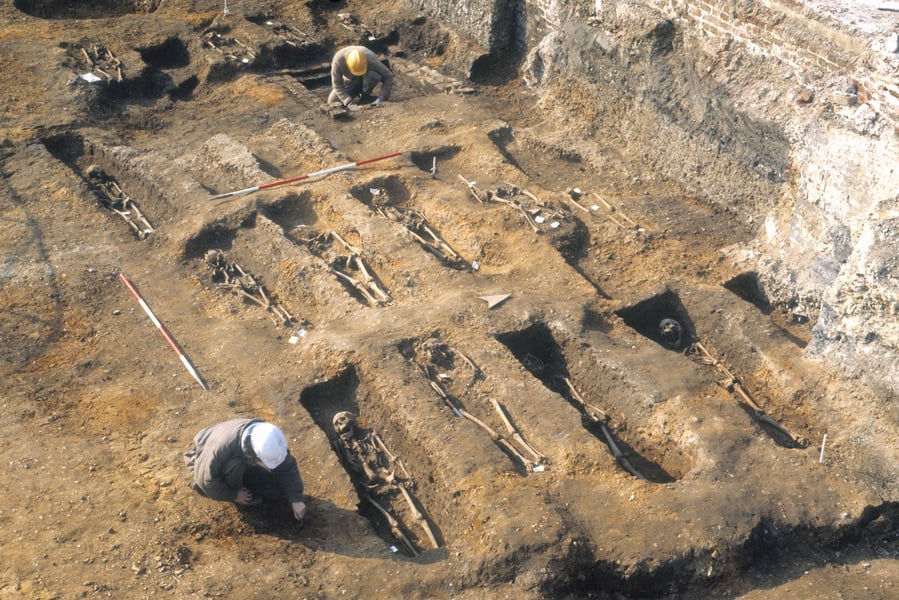 A mass grave in Sudan with UN peacekeepers surveying the site