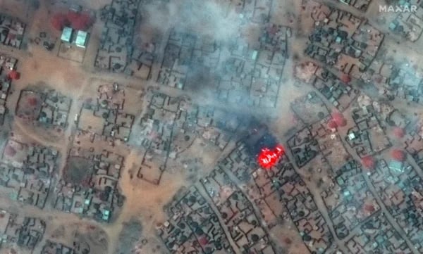Aerial view of overcrowded displacement camp in Sudan showing thousands of makeshift shelters amid famine conditions during civil war