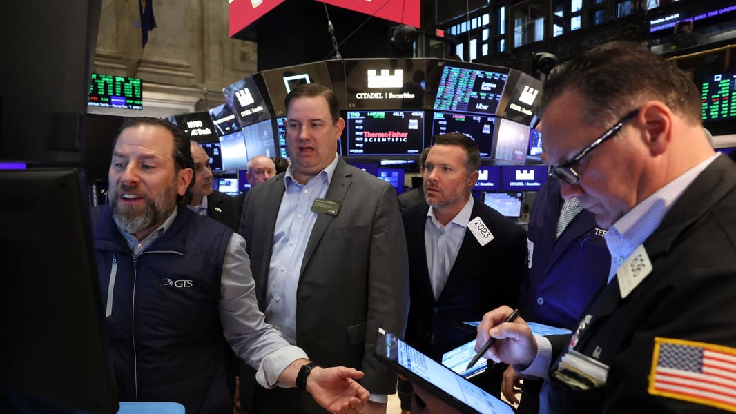 Wall Street traders at New York Stock Exchange during volatile market session