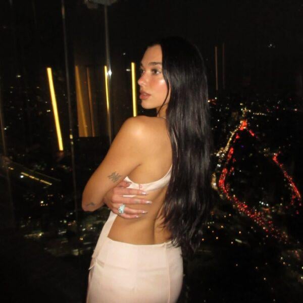 Dua Lipa bare back mini dress Mexico City panoramic skyline Radical Optimism Tour