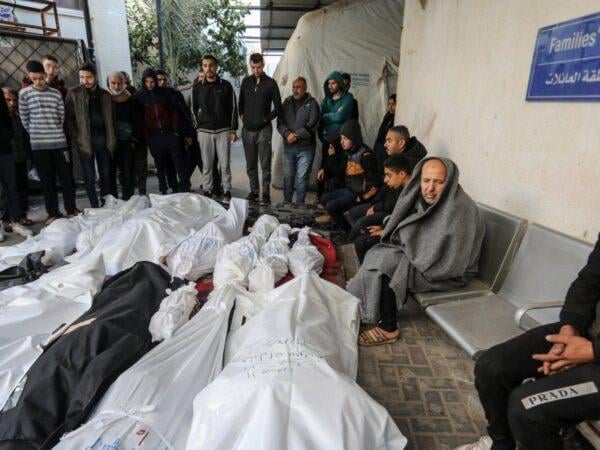 Palestinian mourners carry body of teenager killed by Israeli forces in West Bank raid December 2025