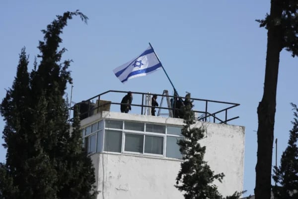 Israeli police raise flag over raided UNRWA HQ East Jerusalem Gaza Day 732