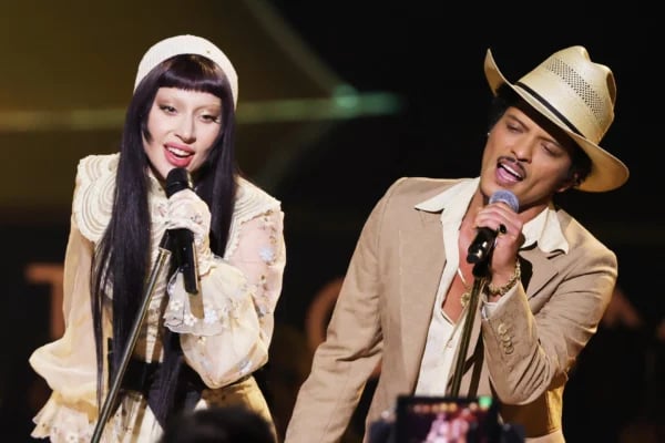 Lady Gaga and Bruno Mars performing hit "Die With A Smile" in 2025