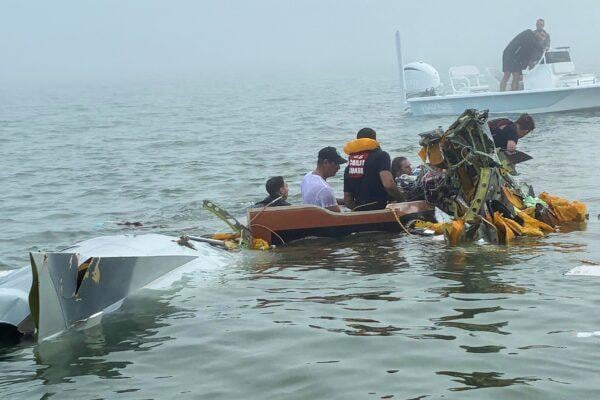 Mexican Navy aircraft crash site in Galveston Bay with Coast Guard rescue boats and emergency responders