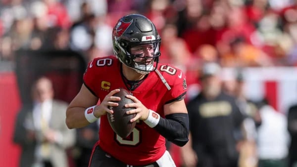 Baker Mayfield celebrates in rain after Buccaneers defeat Panthers 16-14 at Raymond James Stadium in NFC South playoff race