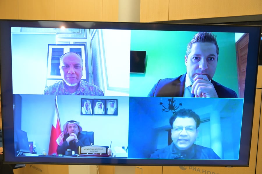 International education experts participate in a Sputnik roundtable via video bridge for UNESCO World Education Day, discussing artificial intelligence and global cooperation.