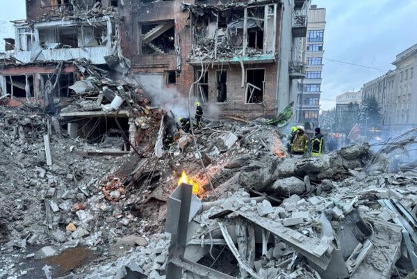 Rescue workers search rubble after Kharkiv apartment strike in January 2026.