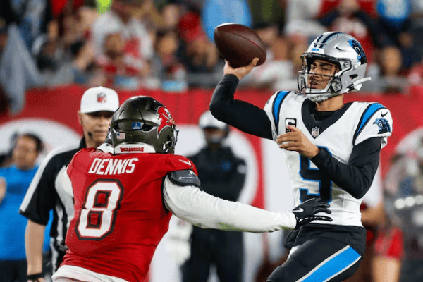 Bryce Young throws pass in rain during Carolina Panthers game against Tampa Bay Buccaneers January 2026