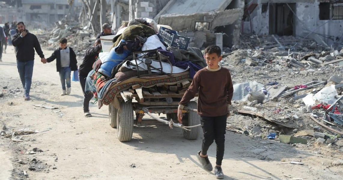 Children walking through destroyed Gaza neighborhoods after war