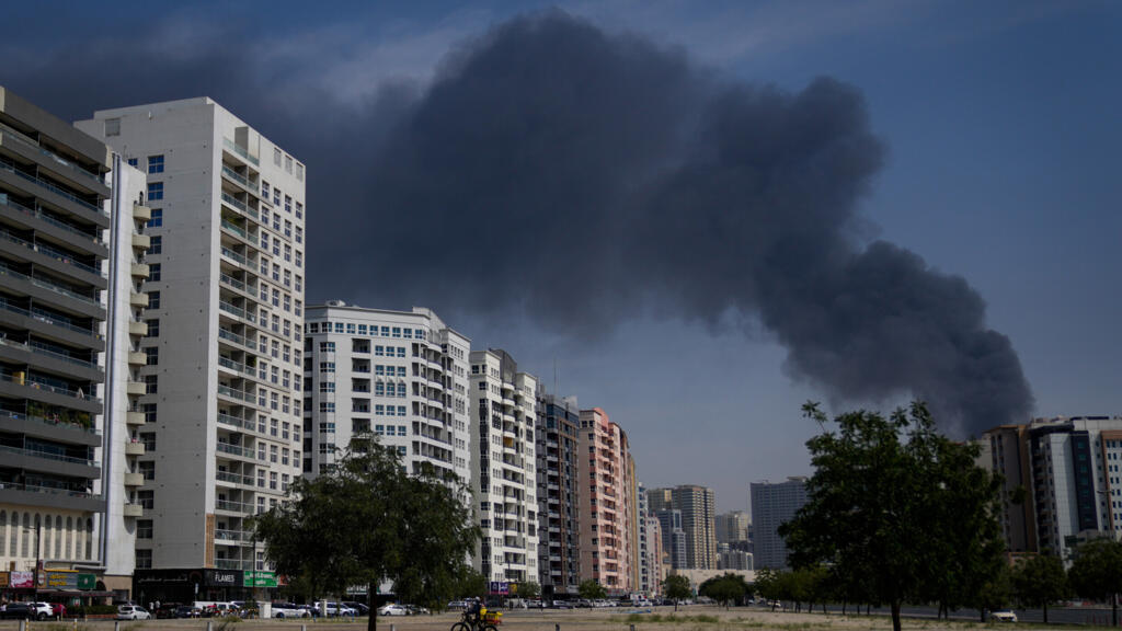 Smoke Plumes Over UAE Citie Smoke plumes over UAE cities after Iranian missile strikes