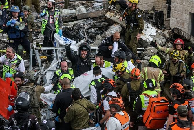Israeli emergency responders at scene of Iranian missile strike in Jerusalem