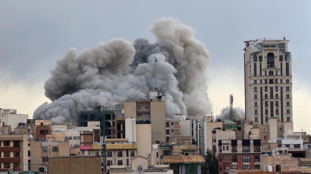 Smoke rises after missile strikes during the Israel Iran war as attacks spread across Gulf cities.