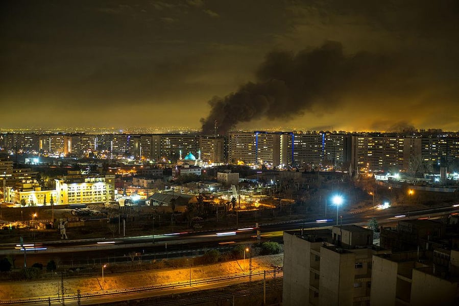 Tehran skyline lit by explosions after Israeli airstrikes hit oil and military targets in Iran