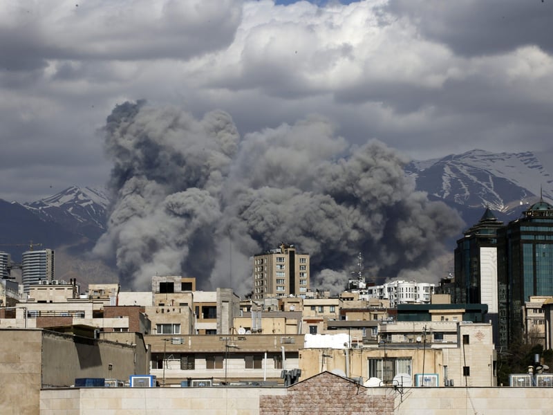 Israel attacks Iran as smoke rises over Tehran following US-Israeli airstrikes during the escalating Iran-Israel war