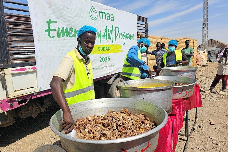 Sudanese civilians waiting for food aid amid humanitarian shortages