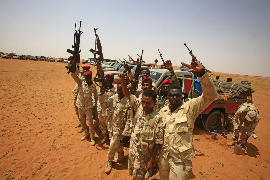 Rapid Support Forces fighters patrol a street in Darfur during the Sudan Civil War