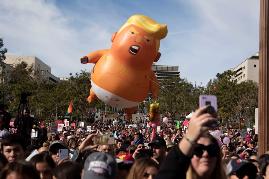 Giant inflatable Trump baby blimp floats above No Kings protesters at Los Angeles City Hall on March 28, 2026