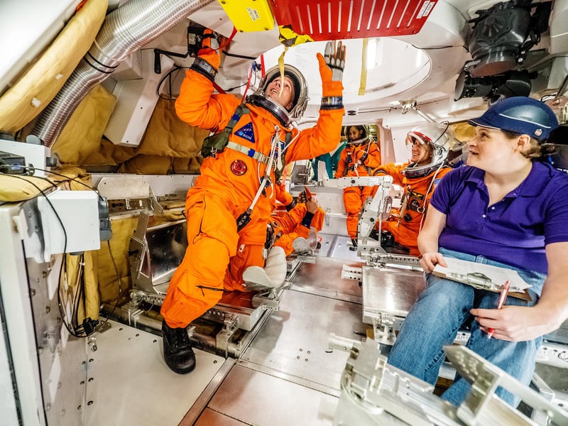 Artemis II astronauts inside Orion spacecraft cockpit during deep space mission