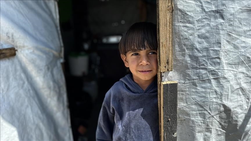 Palestinian children living in destroyed homes amid Gaza Genocide conditions