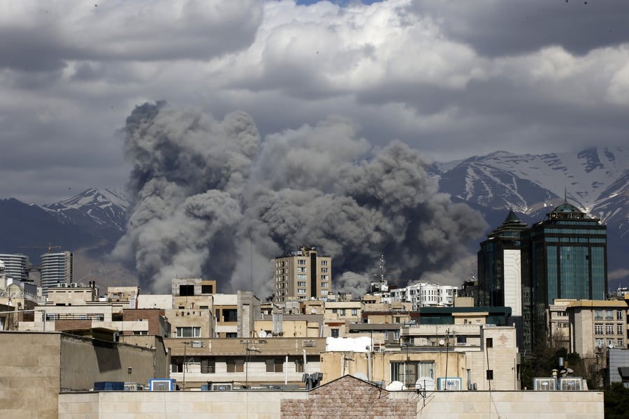 Airstrikes continue despite ceasefire claims Smoke rises after airstrikes in Tehran during Iran war