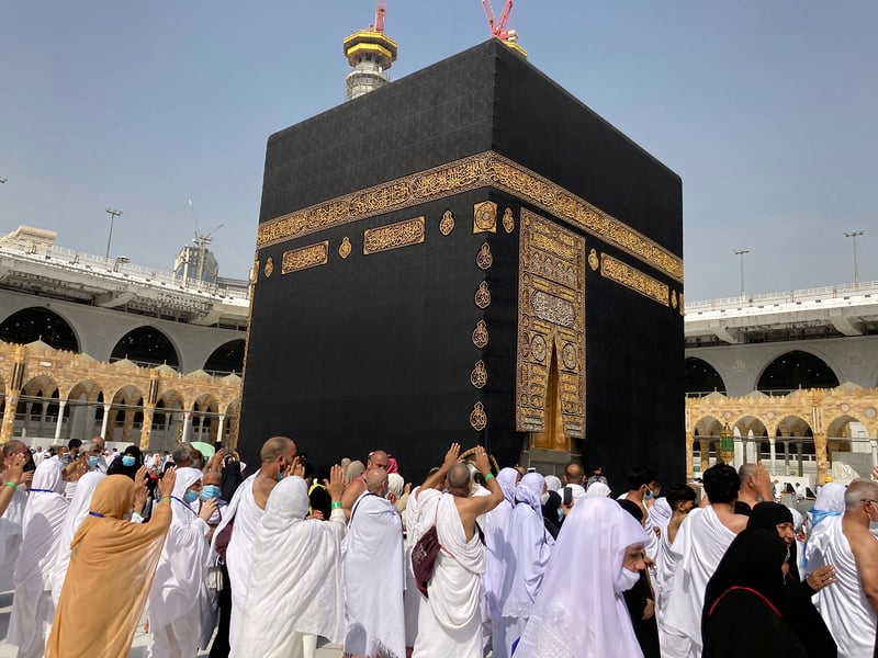 Jeffrey Epstein and UAE billionaire Sultan Ahmed bin Sulayem stand over a sacred Kaaba Kiswa tapestry laid on the floor of Epstein's New York townhouse in 2014