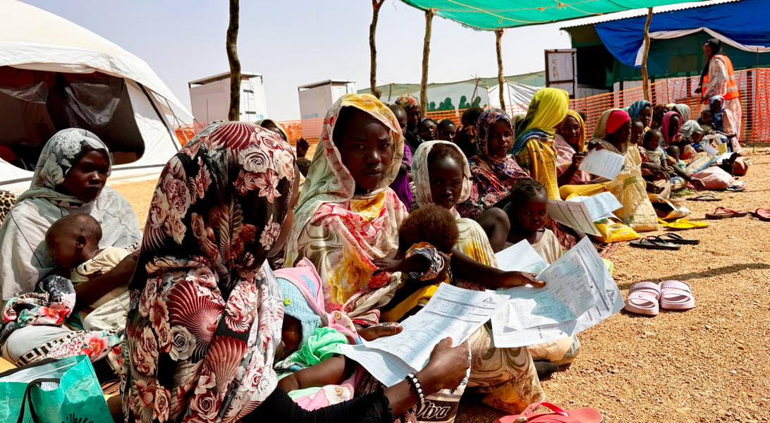 Women Facing Hunger Sudan War Sudanese women waiting in line for humanitarian aid during the war