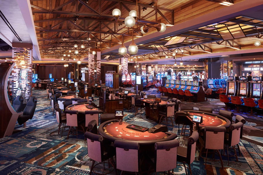 Players using slot machines inside a US casino environment