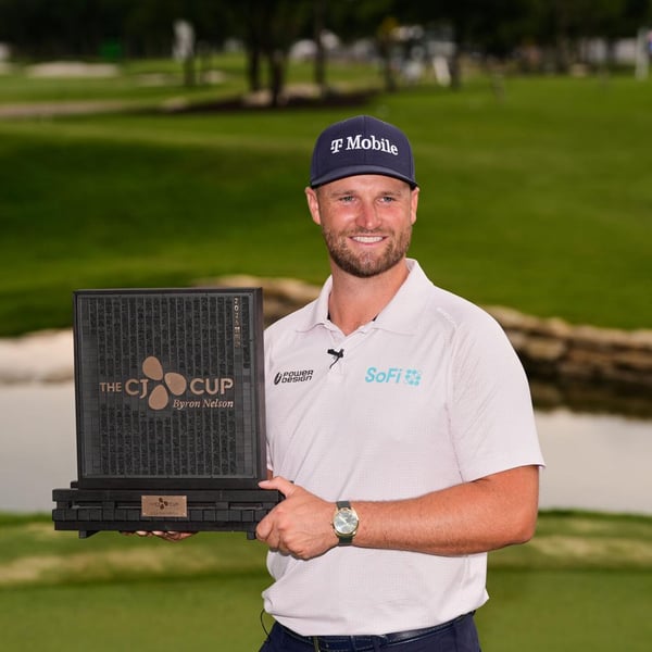Wyndham Clark celebrates with the CJ Cup Byron Nelson trophy after shooting 60 at TPC Craig Ranch