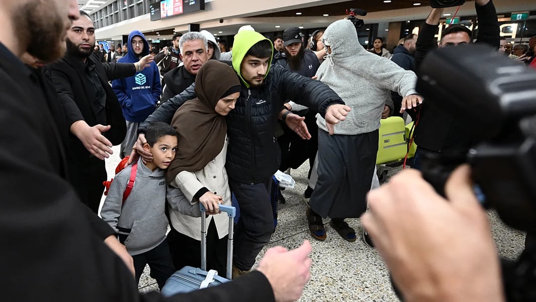 ISIS-linked Australian women and children arrive at Melbourne Airport after returning from Syria