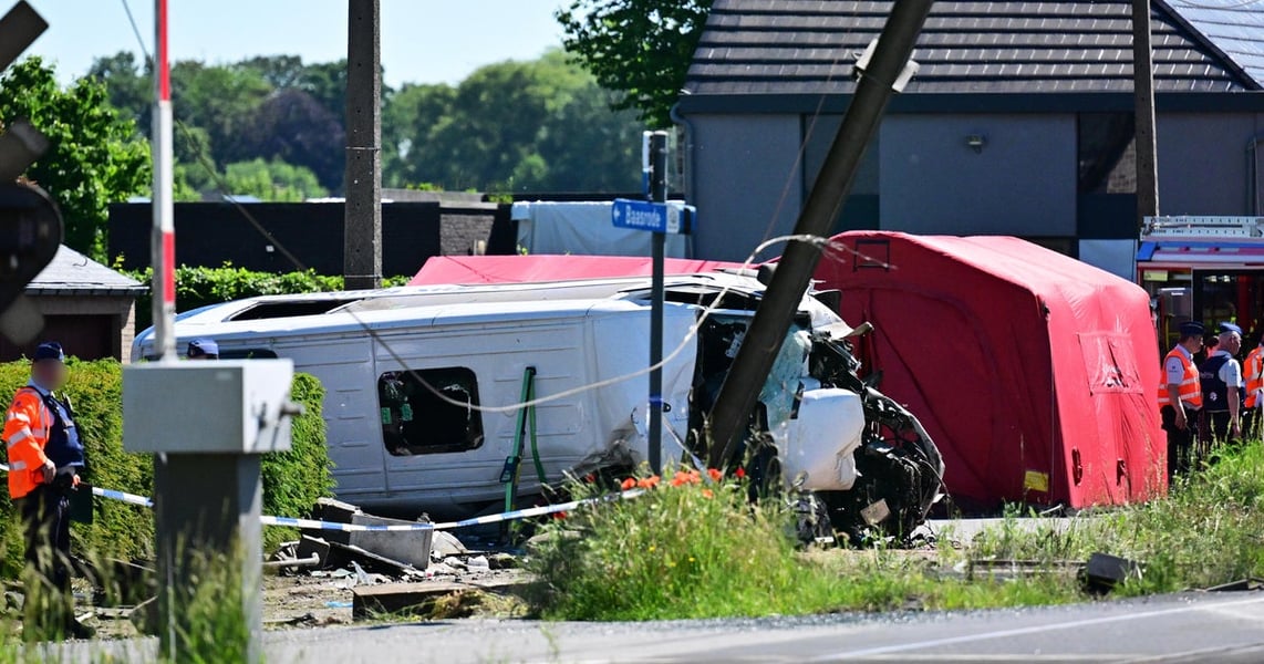 Emergency services at the scene of the train and school minibus crash at the Vierhuizen level crossing in Buggenhout, Belgium