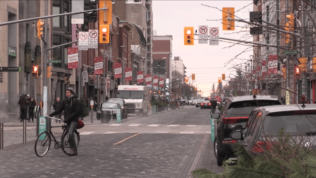 Workers walk through downtown London, Ontario, as unemployment rises across Canada’s industrial economy