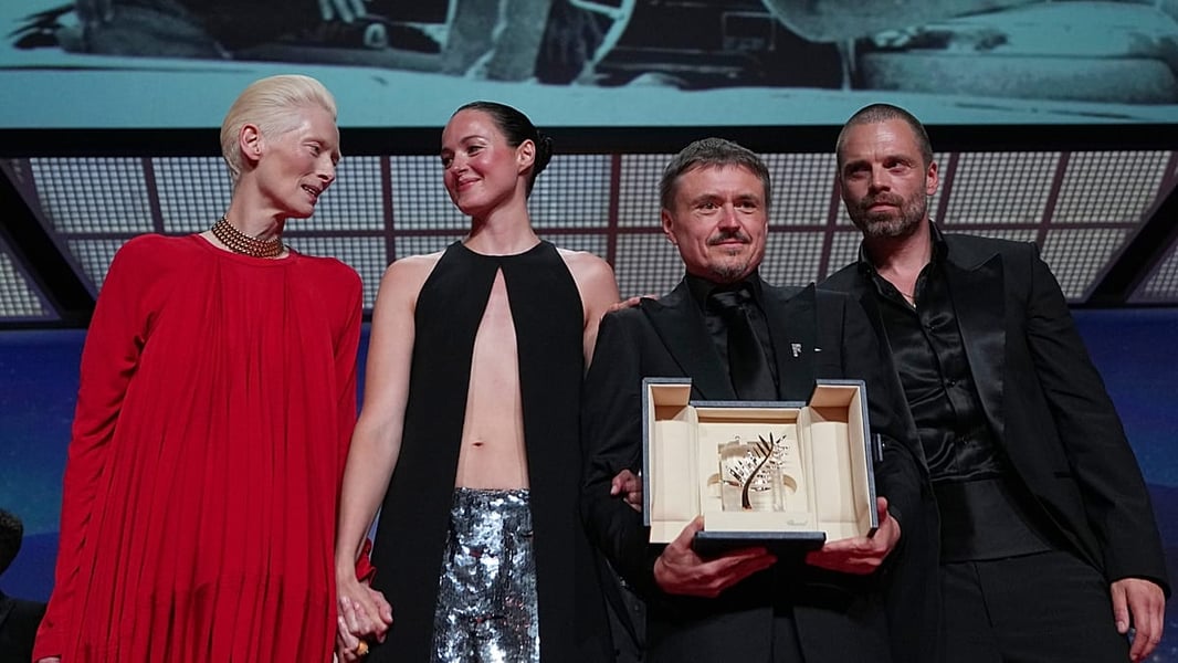 Tilda Swinton, Renate Reinsve, Cristian Mungiu and Sebastian Stan pose on stage during the Palme d'Or presentation at Cannes 2026