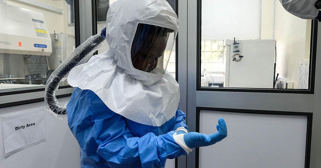 Laboratory technologist in protective equipment at Uganda Virus Research Institute in Entebbe Uganda during Ebola outbreak 2026