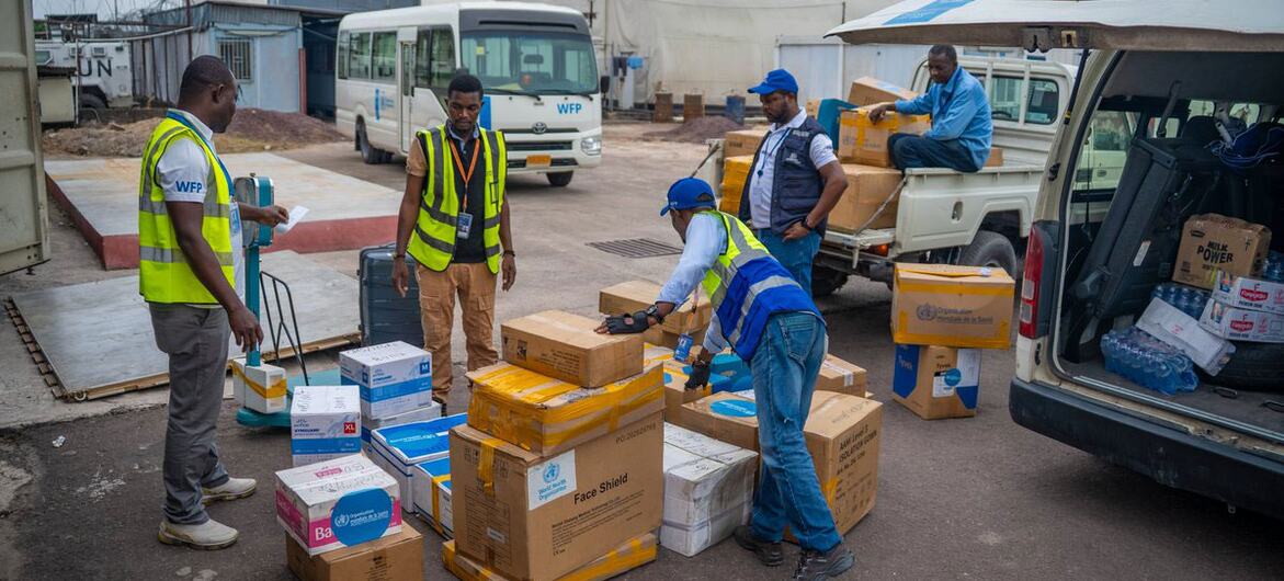WFP staff and responders handle boxes of medical supplies at a logistics site in the Democratic Republic of Congo during Ebola outbreak response 2026