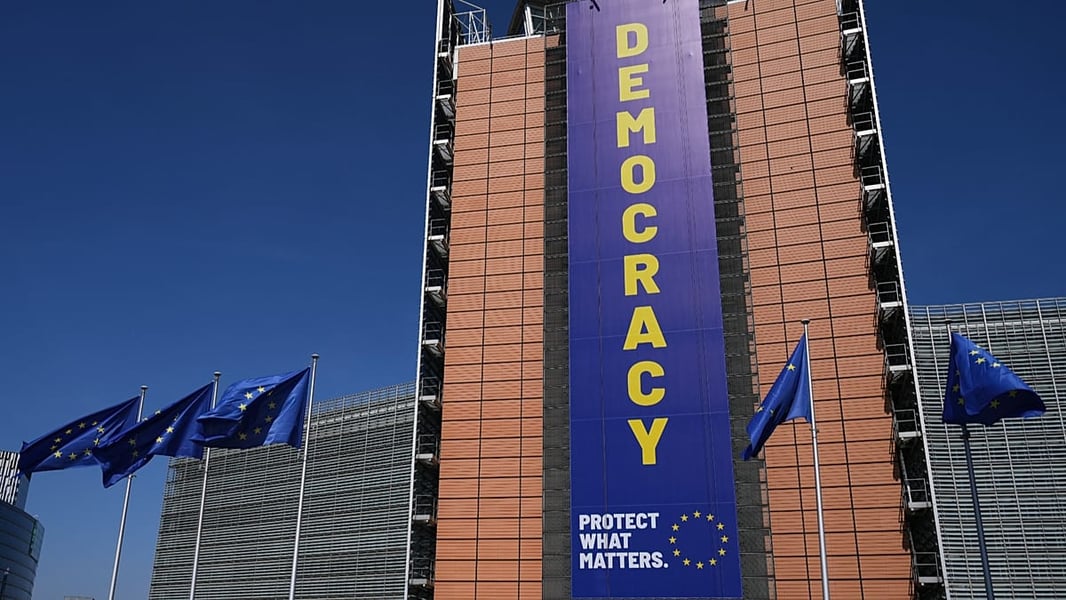 European Union flags fly in front of the Berlaymont building European Commission headquarters Brussels
