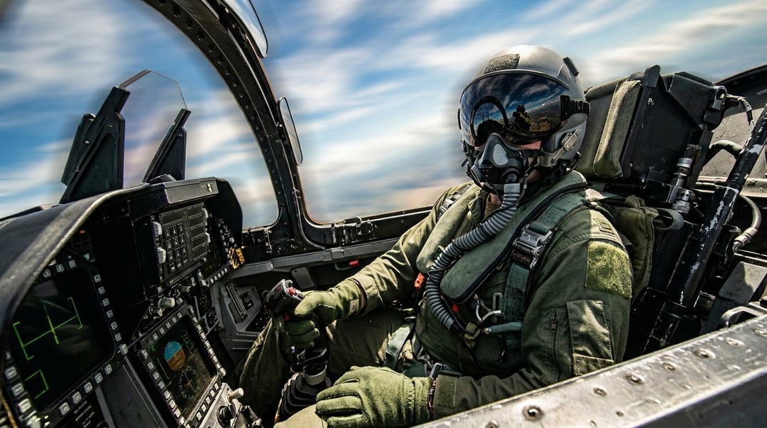 The Aviation-Born Trick Cardiologists Now Recommend for Dizziness Fighter pilot in cockpit demonstrating muscle tensing techniques used to prevent blacking out from G-forces