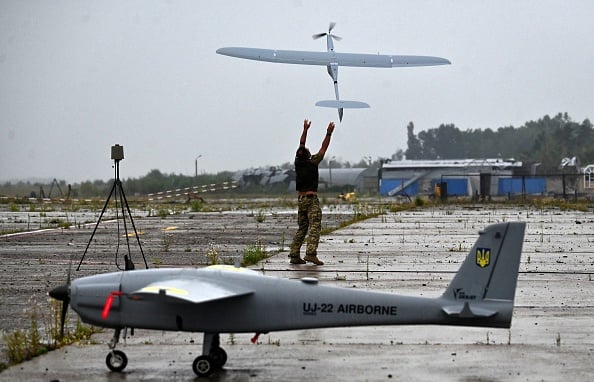 Ukrainian military operator launches a FlyEye WB Electronics Polish reconnaissance drone during test flights in Kyiv region