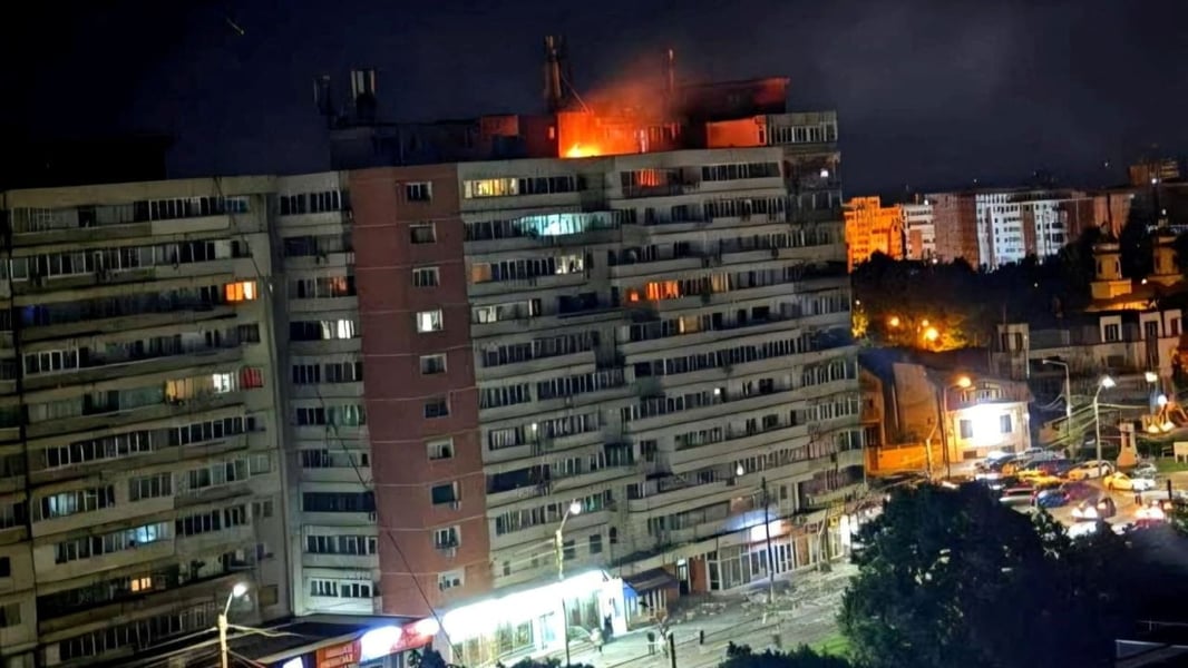 Fire burns on the roof of a 10-story apartment building after a Russian drone strike in Galati Romania May 29 2026