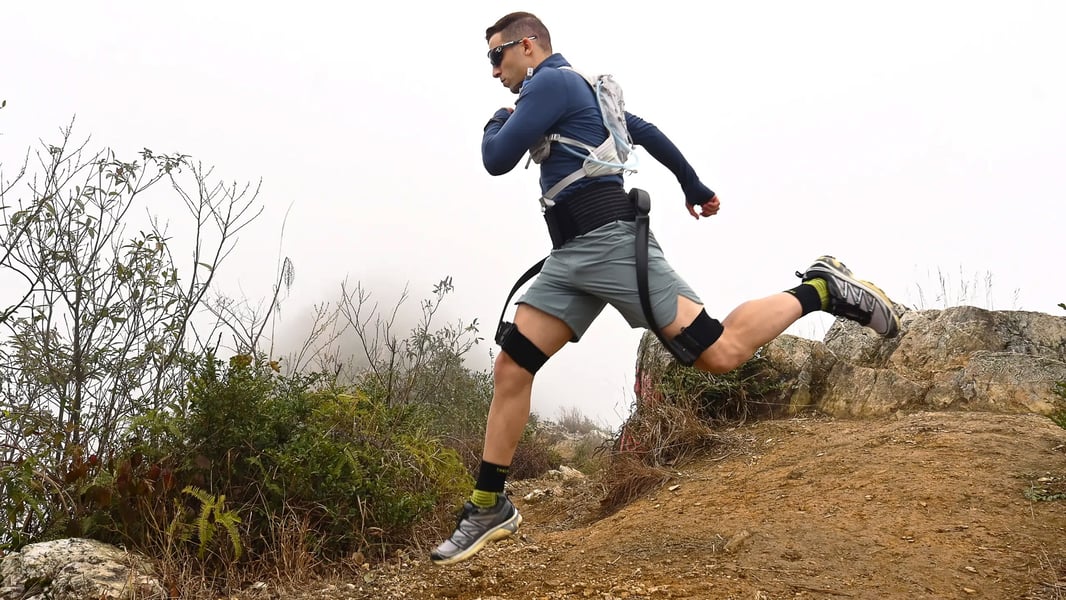 Hiker using the Hypershell X Ultra AI-powered exoskeleton on a mountain trail