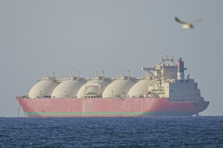 Iranian naval patrol boats operating near oil tankers in the Strait of Hormuz
