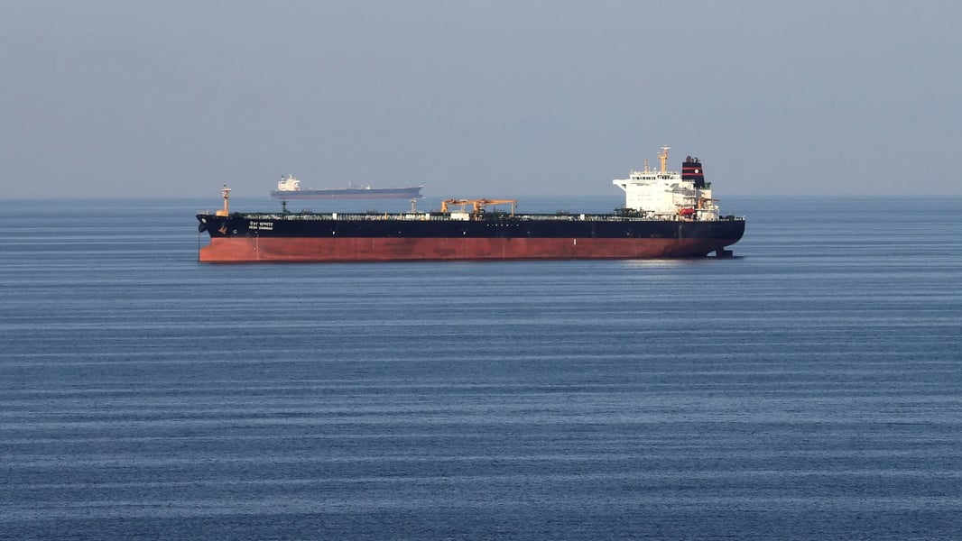 Oil tankers and military vessels near the Strait of Hormuz during escalating Israel-Iran conflict