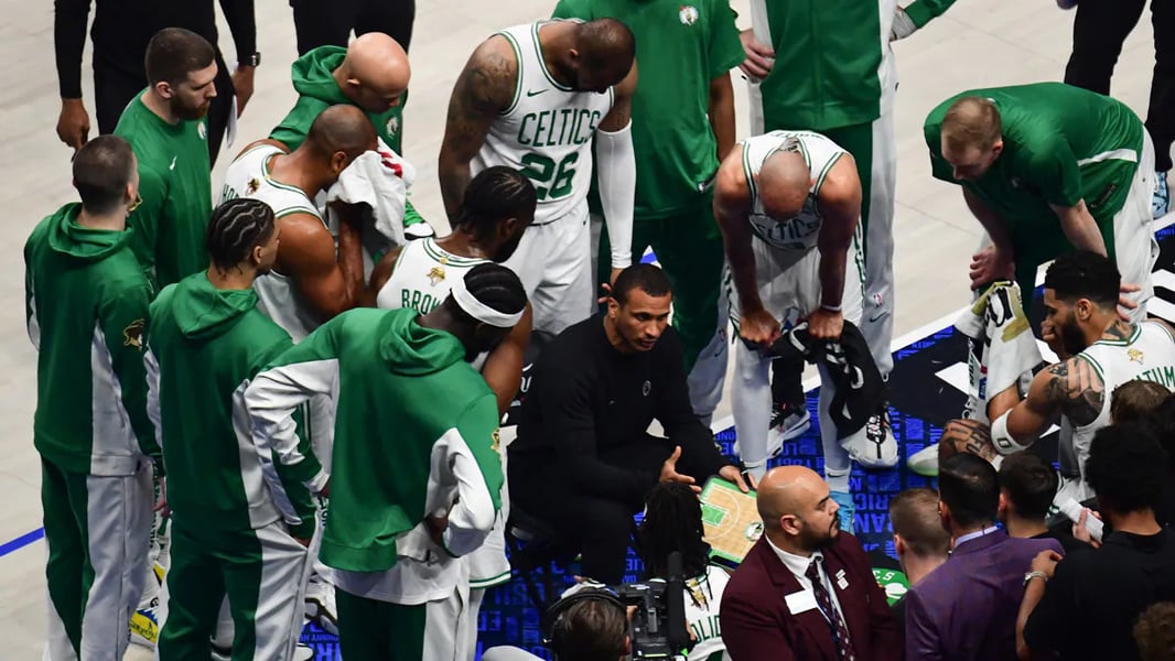Joe Mazzulla instructs Boston Celtics players during a timeout