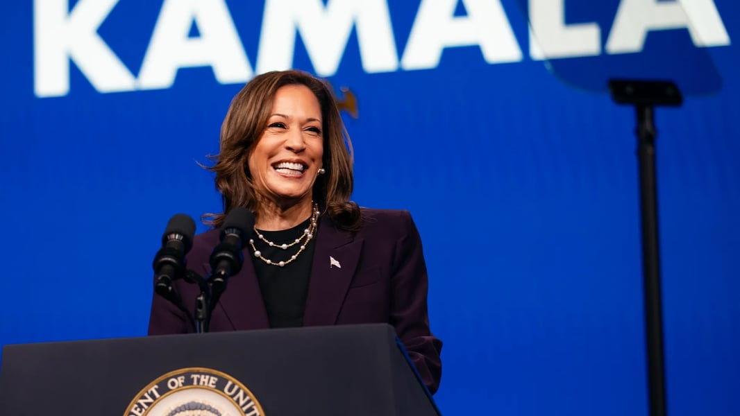 Kamala Harris speaking at podium with symbolic empty donor gala background representing fundraising withdrawal