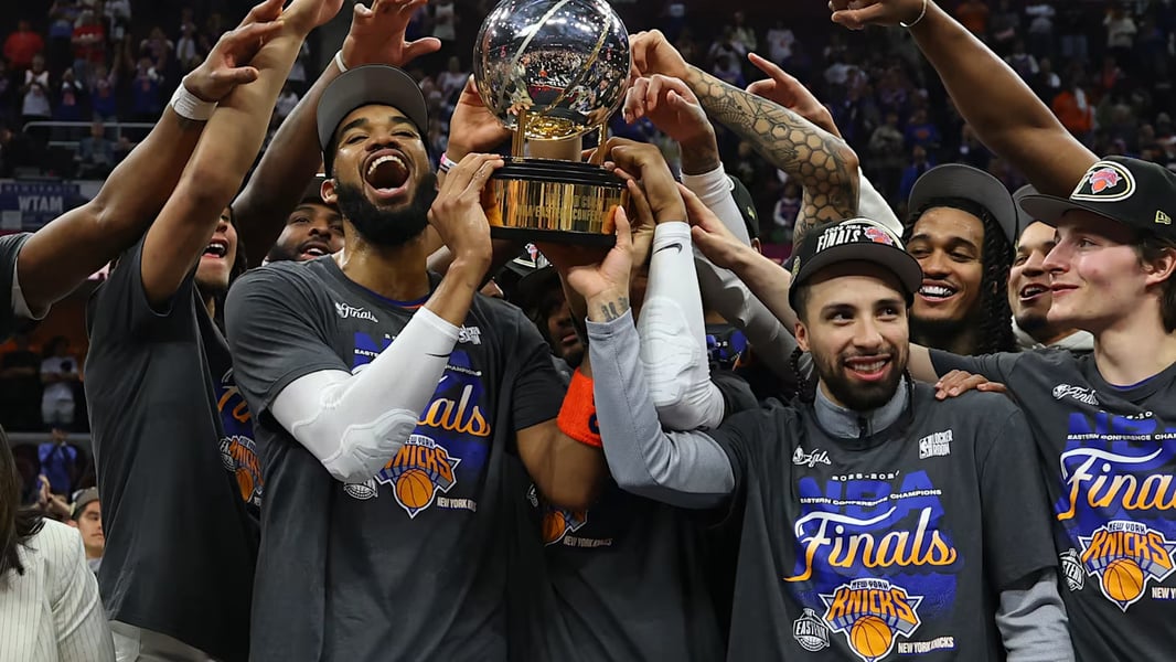 New York Knicks players celebrating on court after sweeping Cavaliers to reach NBA Finals 2026