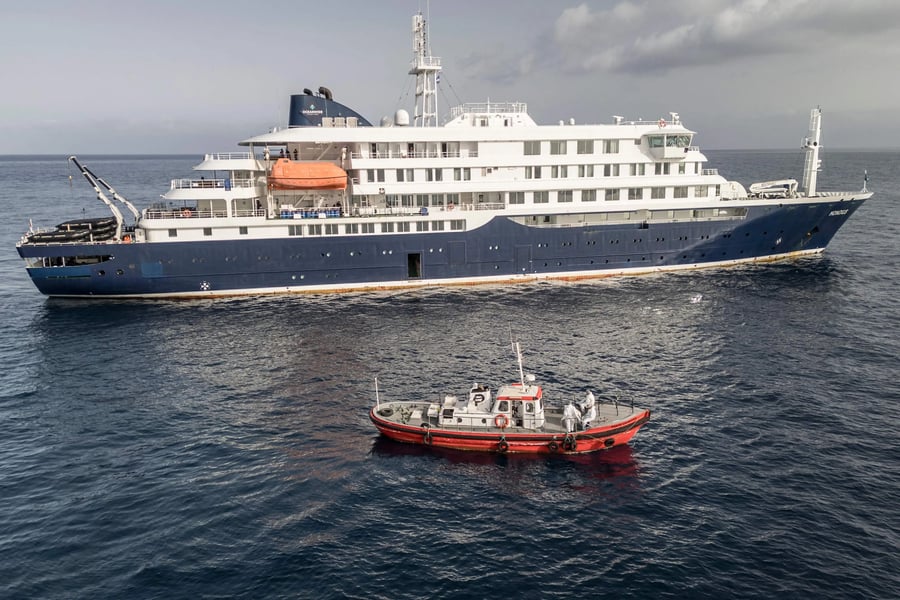 Medical teams in protective suits board MV Hondius during hantavirus outbreak investigation