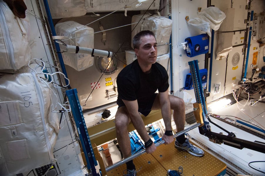 NASA astronaut Chris Cassidy uses ARED exercise equipment on the ISS Astronaut Chris Cassidy gets a workout on the Advanced Resistive Exercise Device in the ISS Tranquility node during Expedition 36