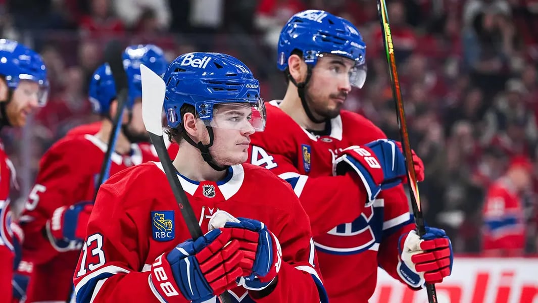 Nick Suzuki and Cole Caufield celebrate during Montreal playoff action